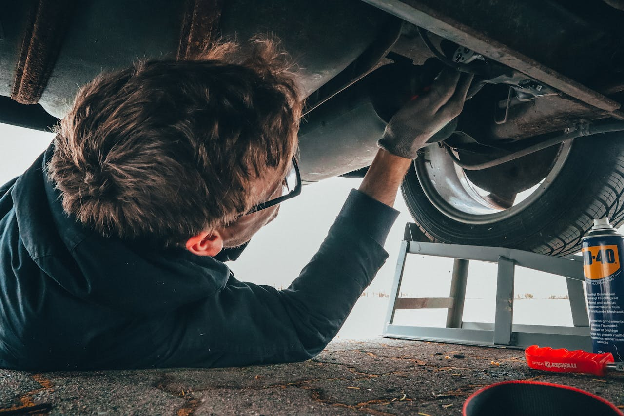 Man Fixing Vehicle Engine. Photo by Malte Luk on pexels.com