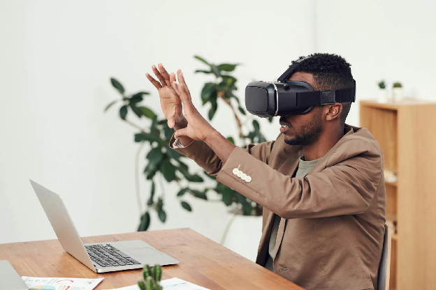 Man Using VR Goggles. Photo by fauxels on pexels.com.