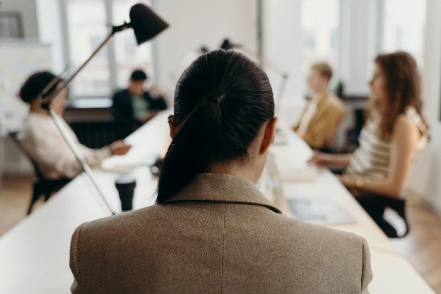 Woman in Brown Coat Sitting on Chair. Photo by cottonbro studio on pexels.com