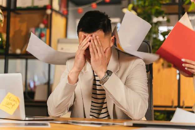 Man Stressed at Work. Photo by ANTONI SHKRABA production on pexels.com.