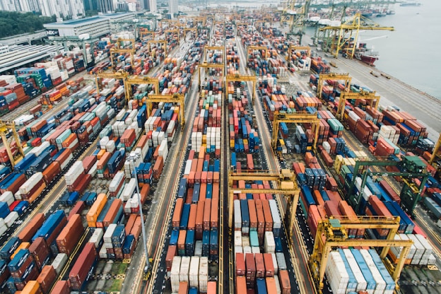 Aerial photo of cargo crates. Photo by CHUTTERSNAP on Unsplash.